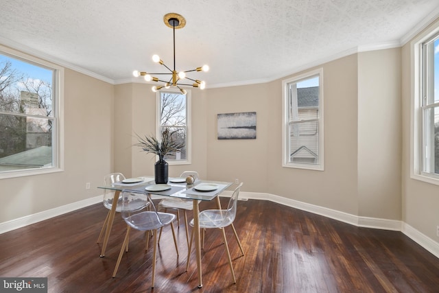 dining room featuring a textured ceiling, crown molding, a chandelier, and dark hardwood / wood-style flooring