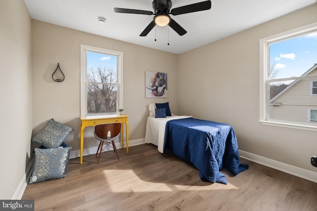 bedroom featuring hardwood / wood-style floors and ceiling fan