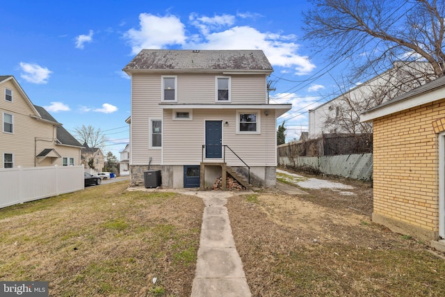 back of house with a yard