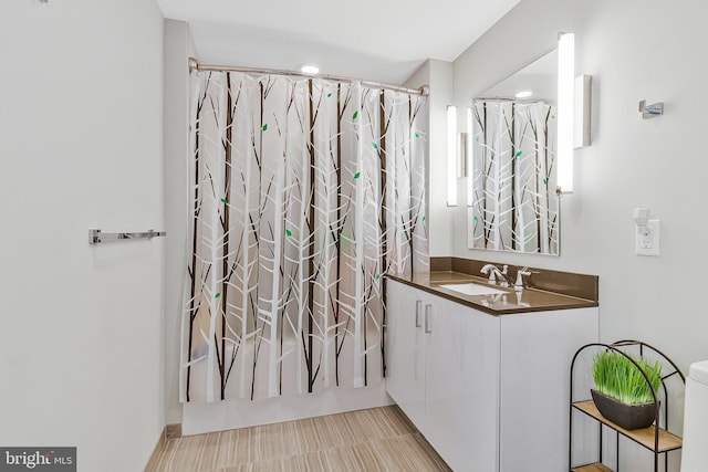 bathroom with shower / bath combo and vanity