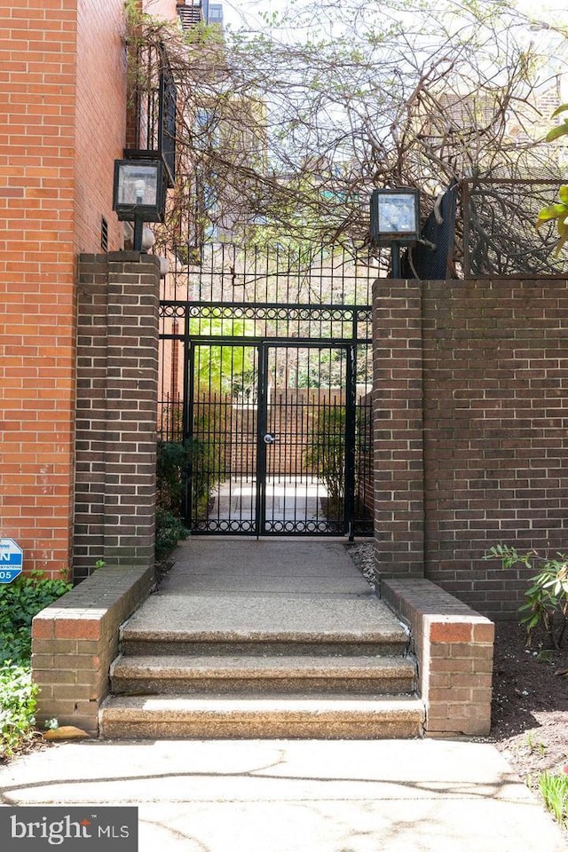 view of gate with fence