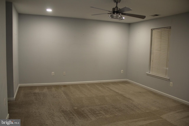 carpeted empty room featuring recessed lighting, visible vents, ceiling fan, and baseboards