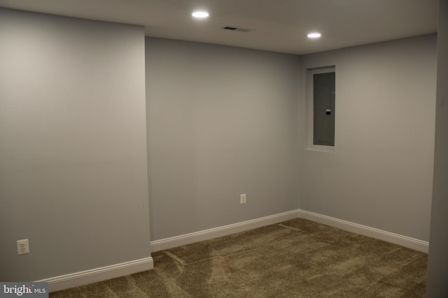 carpeted empty room with recessed lighting, electric panel, visible vents, and baseboards