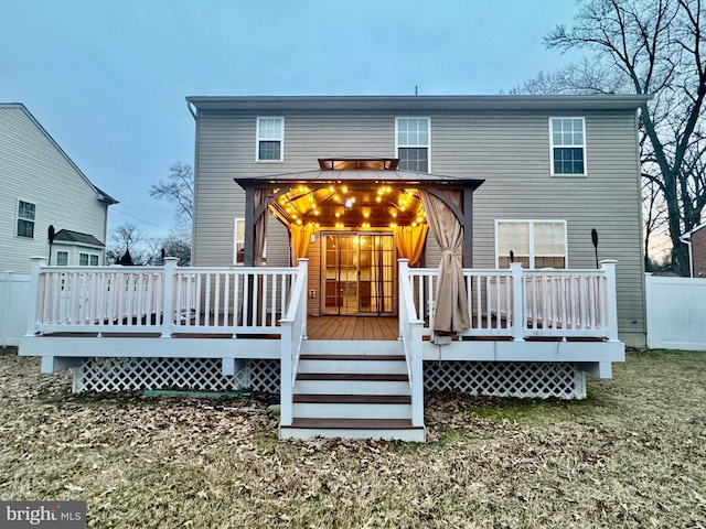 back of property featuring a deck