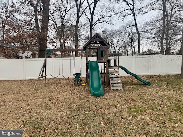 view of play area featuring a yard and fence