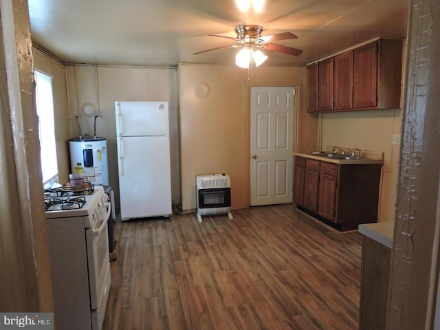 kitchen featuring white appliances, heating unit, water heater, and dark hardwood / wood-style floors