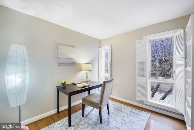 office featuring wood finished floors and baseboards