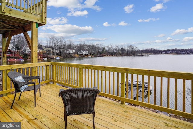 wooden deck featuring a water view