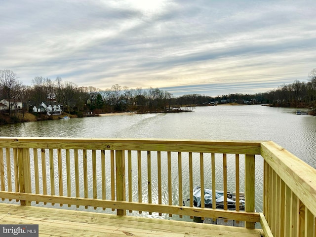 wooden deck featuring a water view