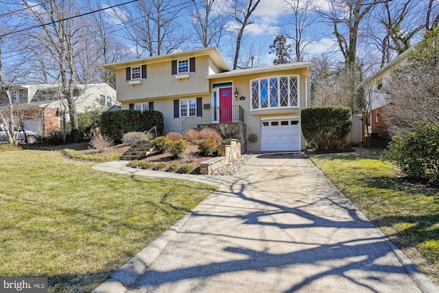 tri-level home with an attached garage, a front lawn, concrete driveway, and brick siding