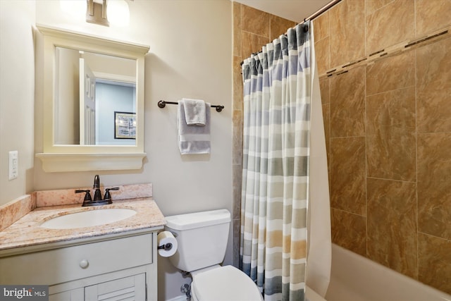 bathroom featuring shower / bath combo, vanity, and toilet