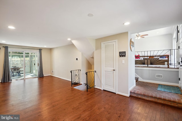 unfurnished living room featuring ceiling fan, hardwood / wood-style flooring, recessed lighting, visible vents, and baseboards