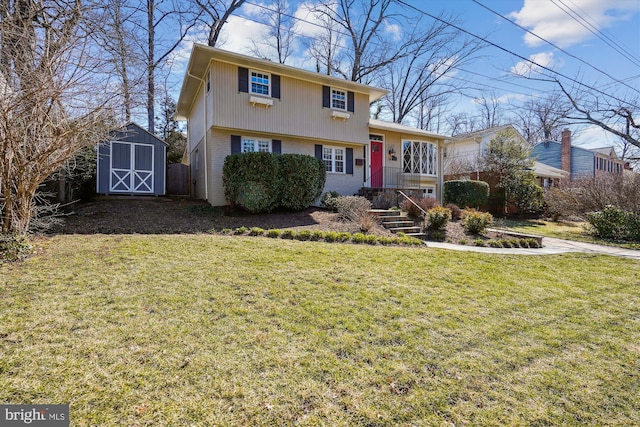 tri-level home featuring a storage shed, a front lawn, an outbuilding, and brick siding