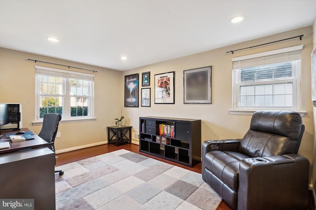 office space with baseboards, wood finished floors, and recessed lighting