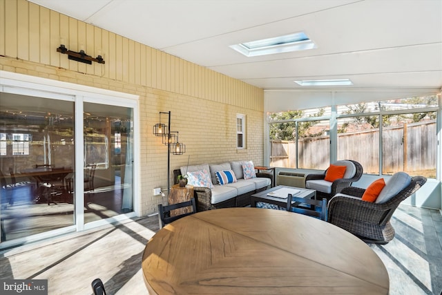 sunroom featuring a skylight