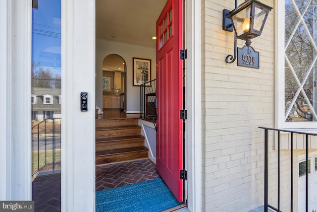 entrance to property with brick siding