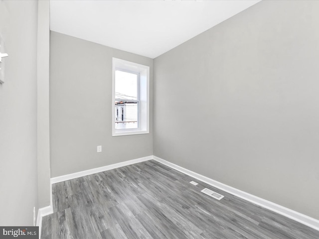 spare room featuring hardwood / wood-style flooring