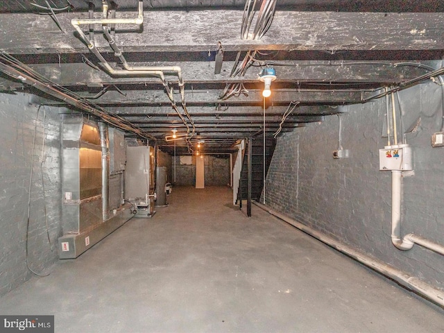 basement with gas water heater and water heater