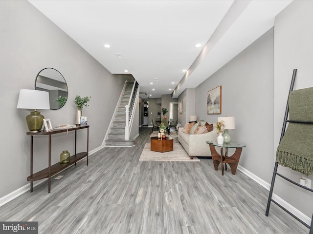 living room with light hardwood / wood-style flooring