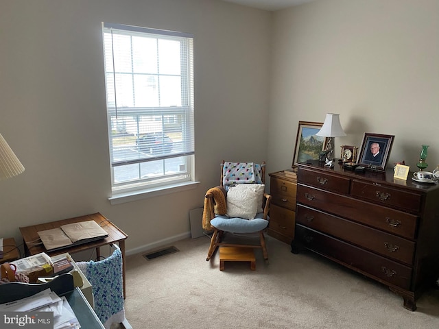 living area with light carpet