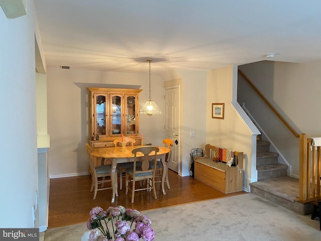dining area with wood-type flooring