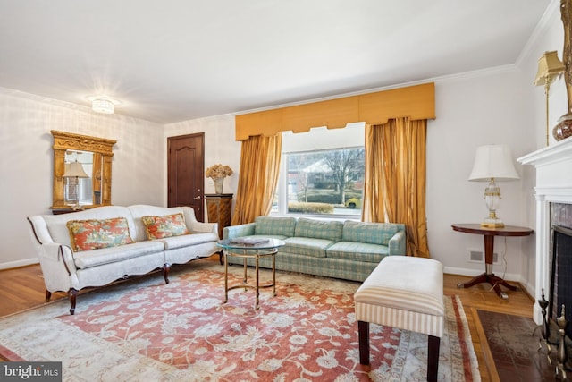 living room featuring wood-type flooring and ornamental molding