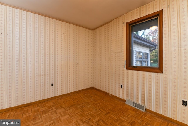 empty room with parquet flooring