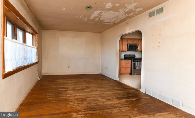 empty room featuring dark wood-type flooring