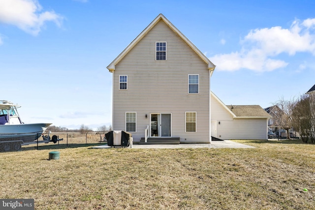 rear view of property featuring a yard and a patio area