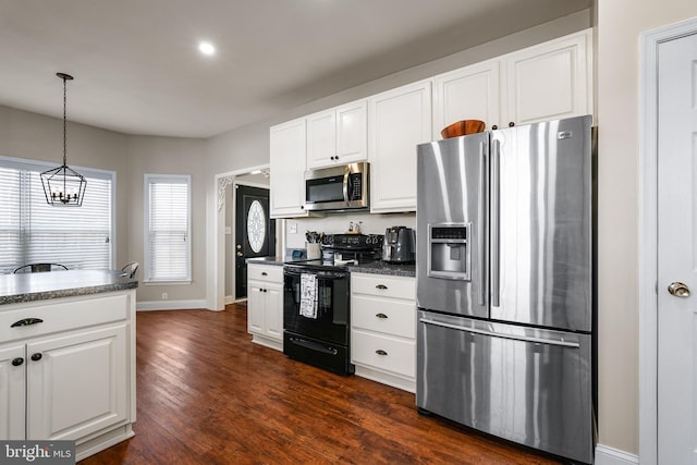 kitchen with plenty of natural light, decorative light fixtures, stainless steel appliances, dark wood-type flooring, and white cabinets