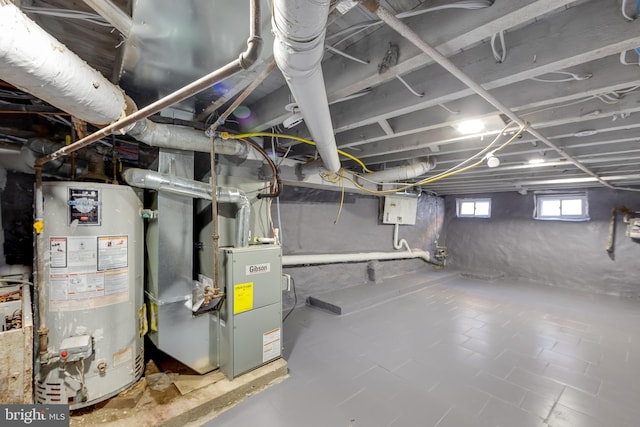 basement featuring heating unit and gas water heater