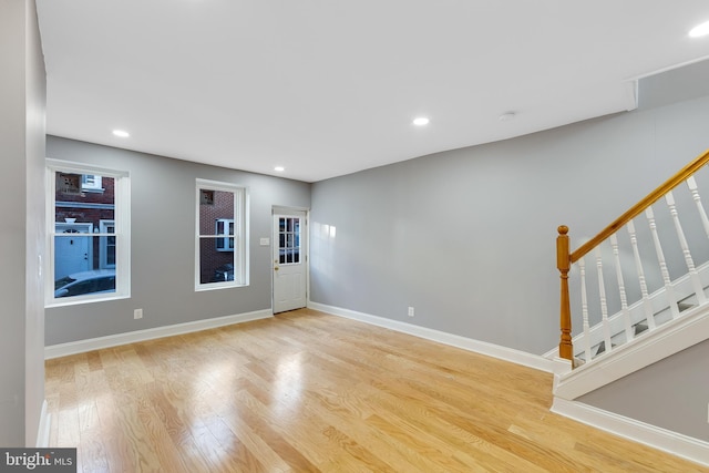 unfurnished room with light hardwood / wood-style floors