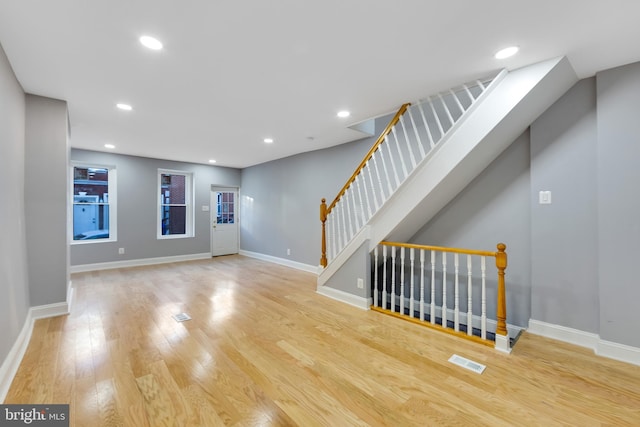 unfurnished living room with light hardwood / wood-style flooring