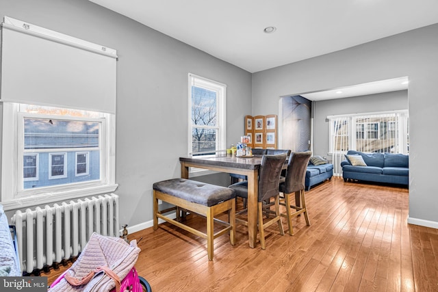 15 White St, Paterson, NJ 07522 - dining room featuring radiator heating unit and light wood-type flooring