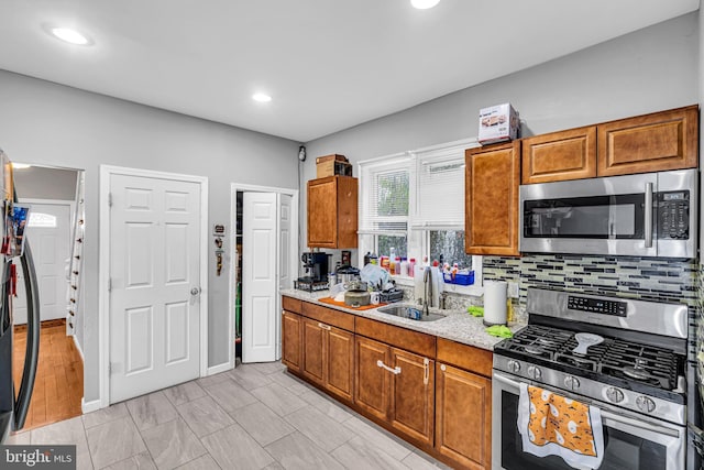 15 White St, Paterson, NJ 07522 - kitchen featuring tasteful backsplash, appliances with stainless steel finishes, and sink