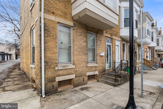 exterior space with brick siding