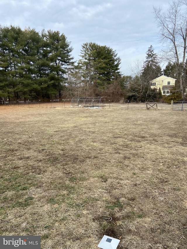 view of yard with a rural view