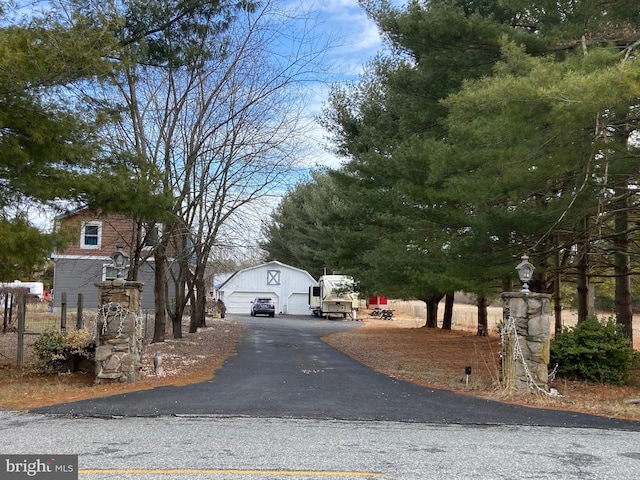 view of street with aphalt driveway