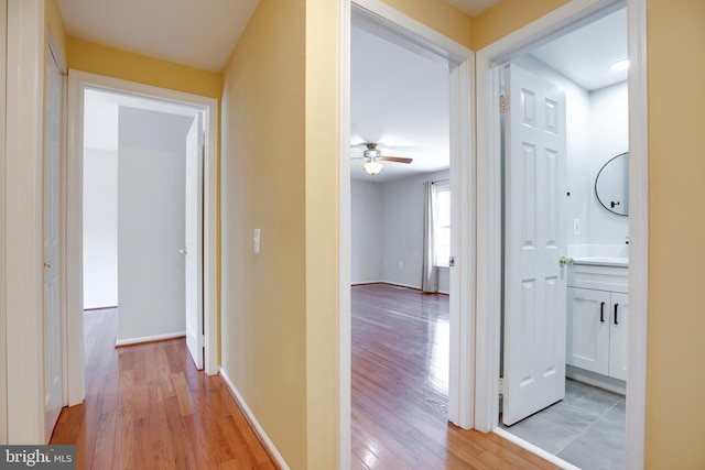 hall with light hardwood / wood-style floors