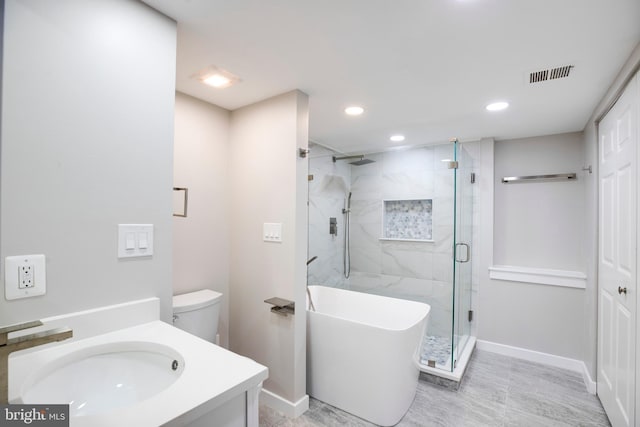 full bathroom featuring toilet, vanity, and independent shower and bath