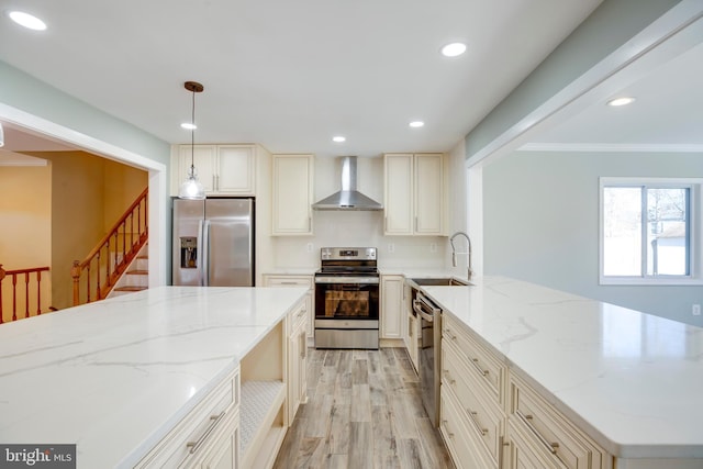 kitchen featuring sink, decorative light fixtures, stainless steel appliances, wall chimney exhaust hood, and light stone countertops