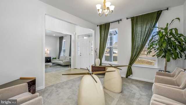 interior space featuring a notable chandelier and light colored carpet