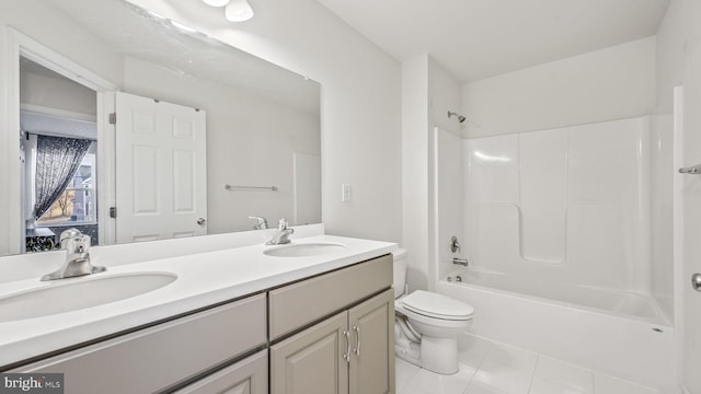 full bathroom featuring toilet, vanity, tile patterned flooring, and shower / bathtub combination