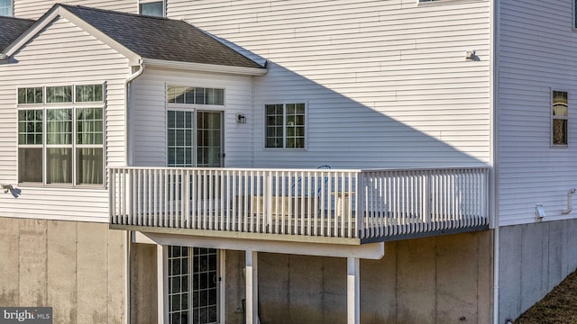 back of property featuring a balcony