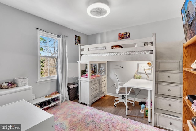 bedroom featuring wood finished floors