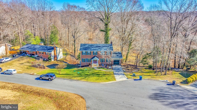 view of front of house featuring a front lawn and driveway