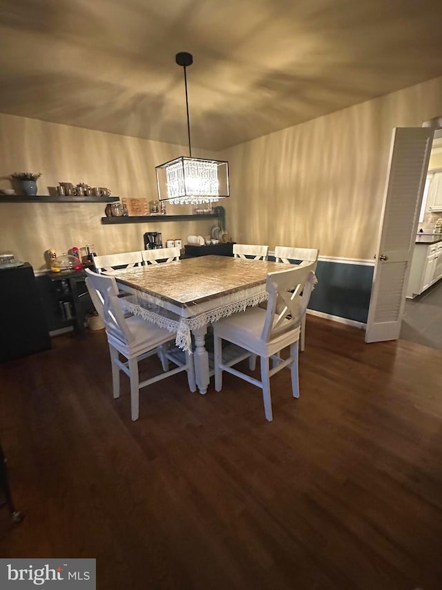 dining area featuring dark wood-style floors