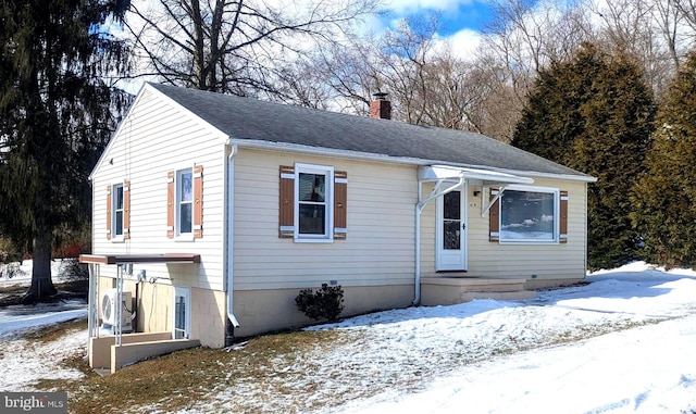 view of front of property featuring ac unit