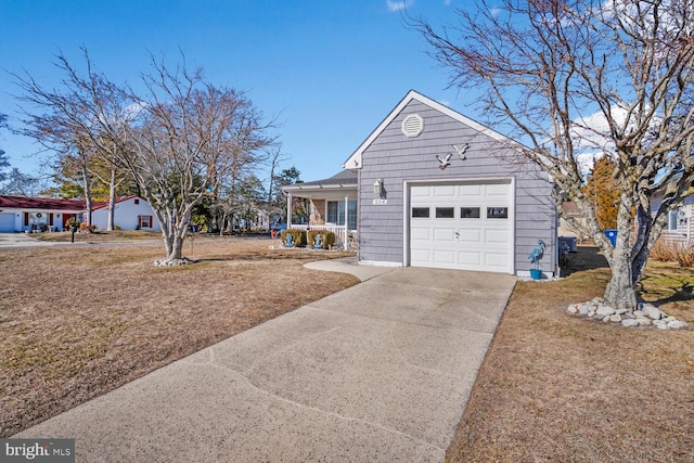 single story home featuring covered porch, a garage, and a front lawn