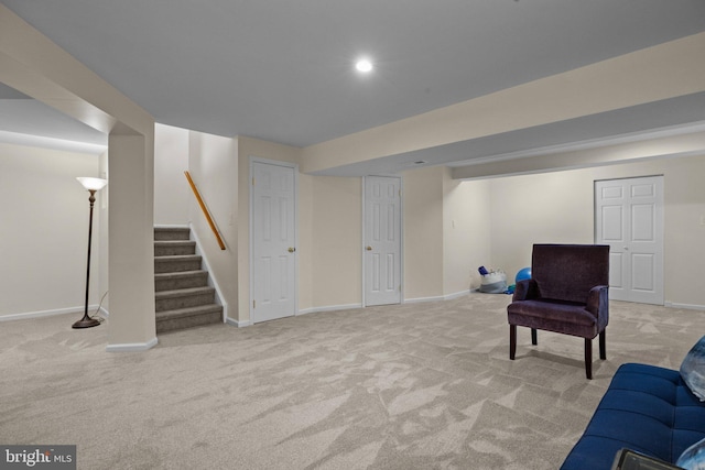 living area with light colored carpet